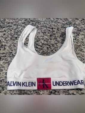 Calvin Klein White Sports Bralette with Navy Logo Band and Red Patch